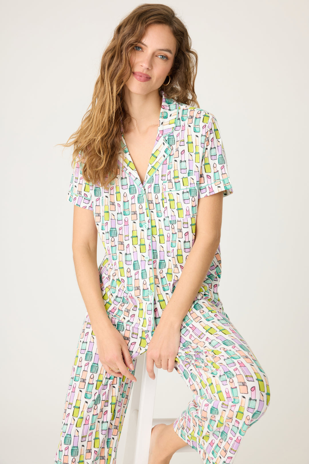 Women's breathable cotton-modal jersey short sleeve pajama set in ivory with multi lipstick print. With teal contrast piping & tie. Button-front top & open leg pant.