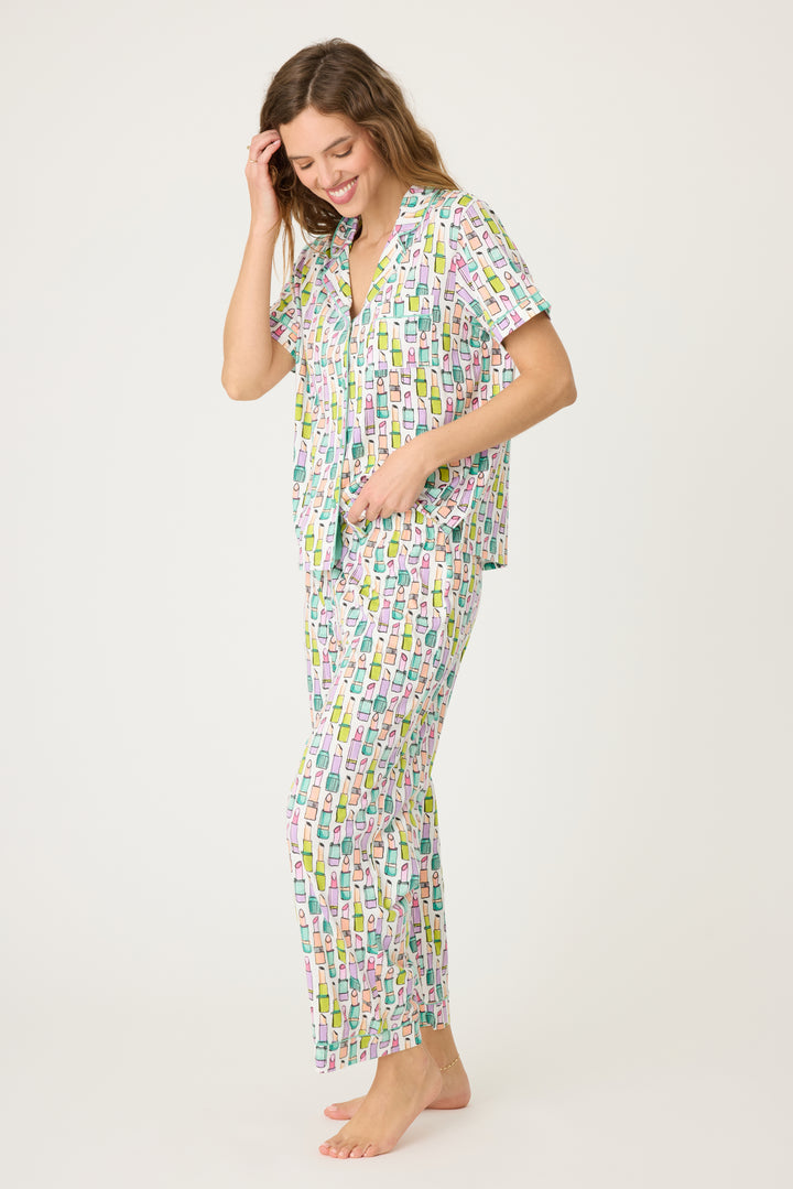 Women's breathable cotton-modal jersey short sleeve pajama set in ivory with multi lipstick print. With teal contrast piping & tie. Button-front top & open leg pant.