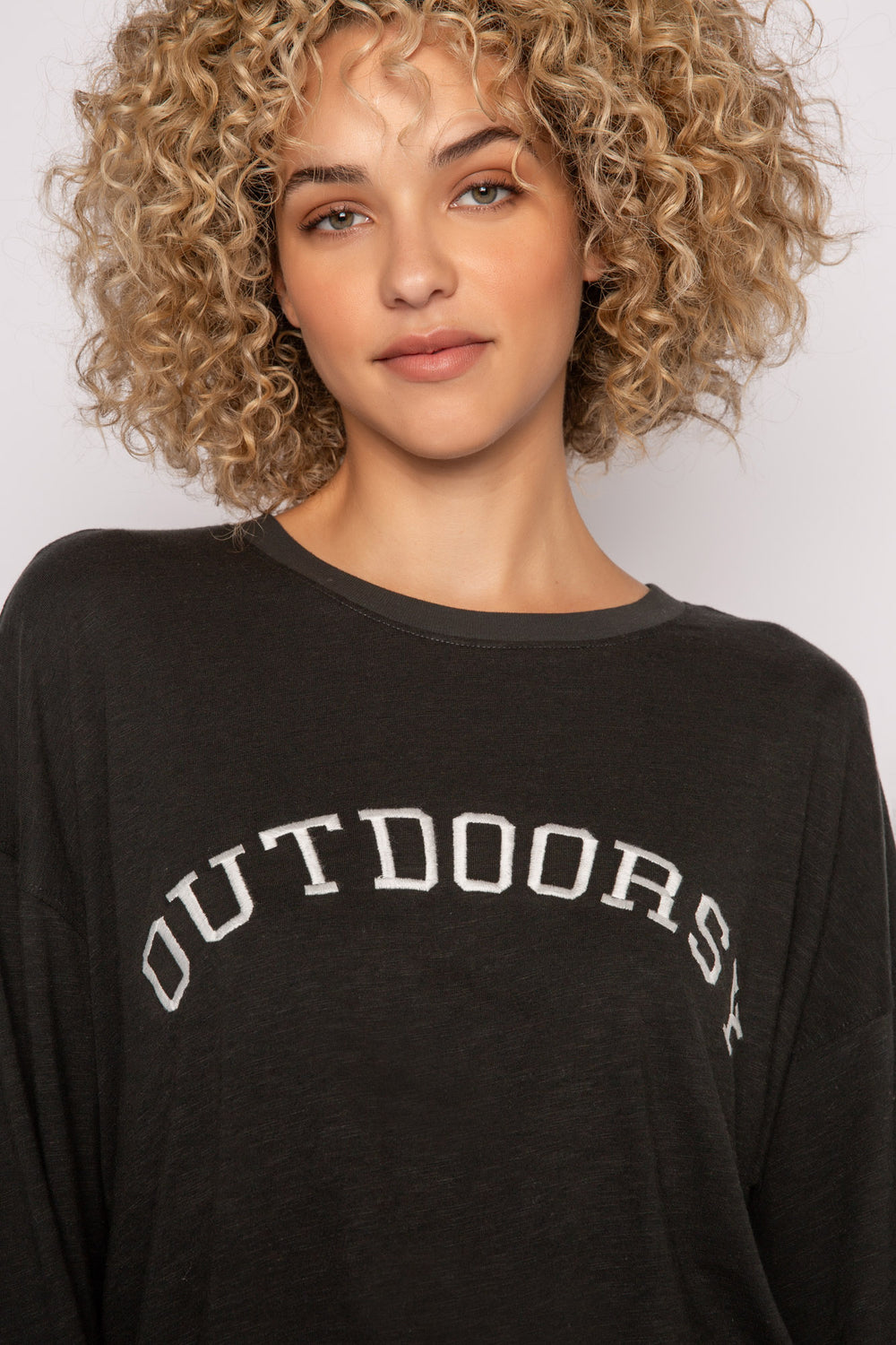 Long sleeve black t-shirt with "Outdoorsy" embroidery on chest. (7231877185636)