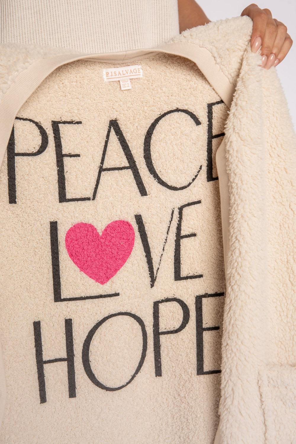 Ivory cardigan sweater with 3-button, front patch pockets & inside Peace-Love screen-print. (7231885410404)