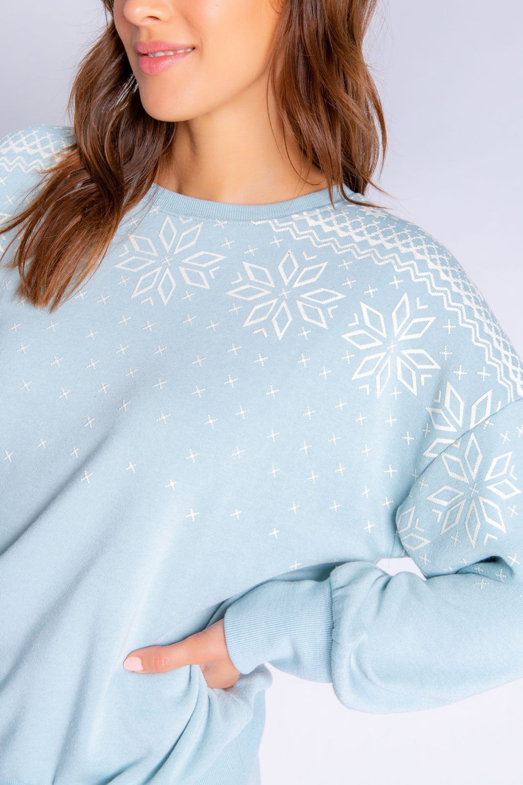 Heather ice blue long sleeve top with white snowflake design on shoulders. (6577417519204) (7000924749924)